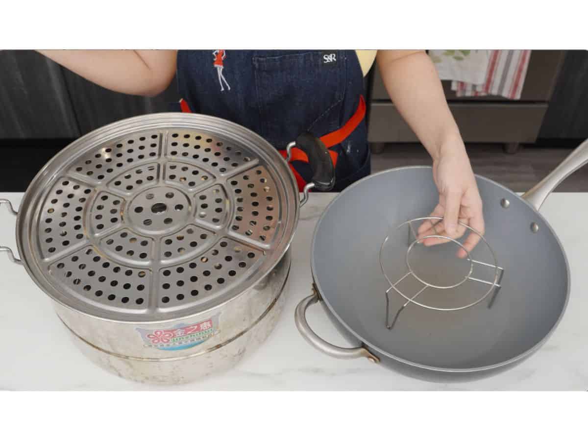 a steamer and a wok with a steamer rack inside.