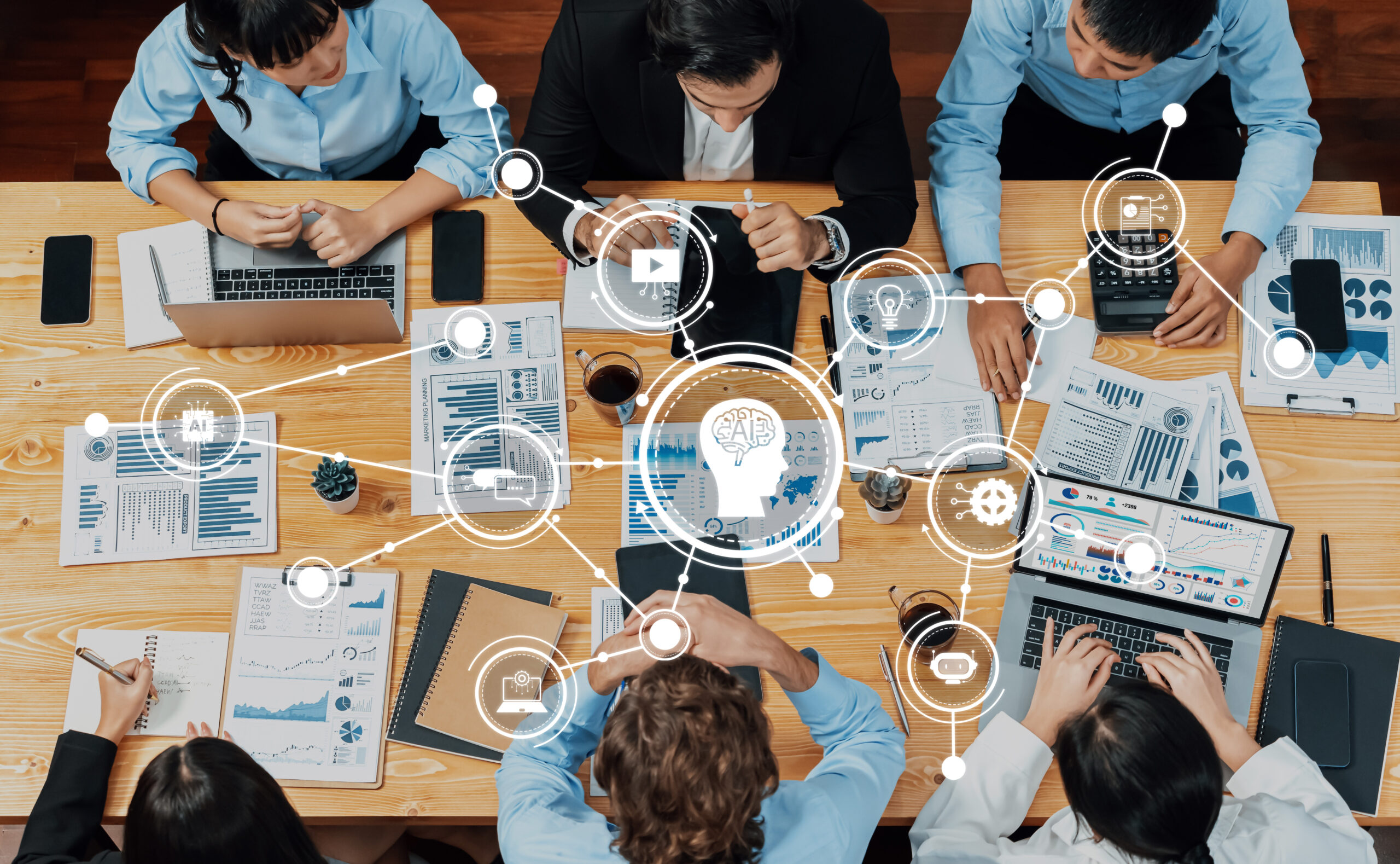 employees at a table with data