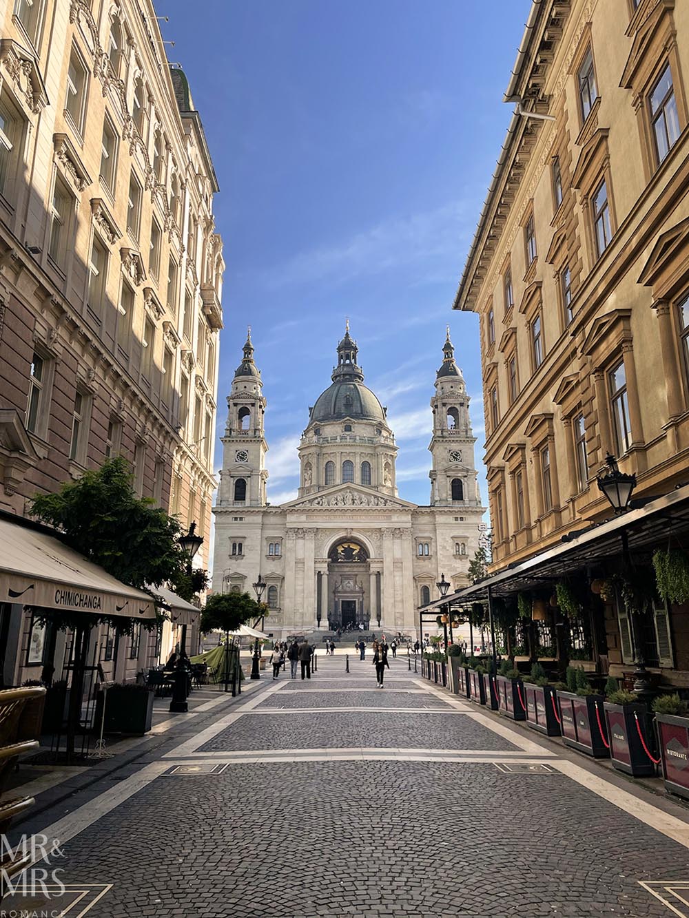 Essential travel guide to Budapest, Hungary - city streets with a view of the opera house in the distance