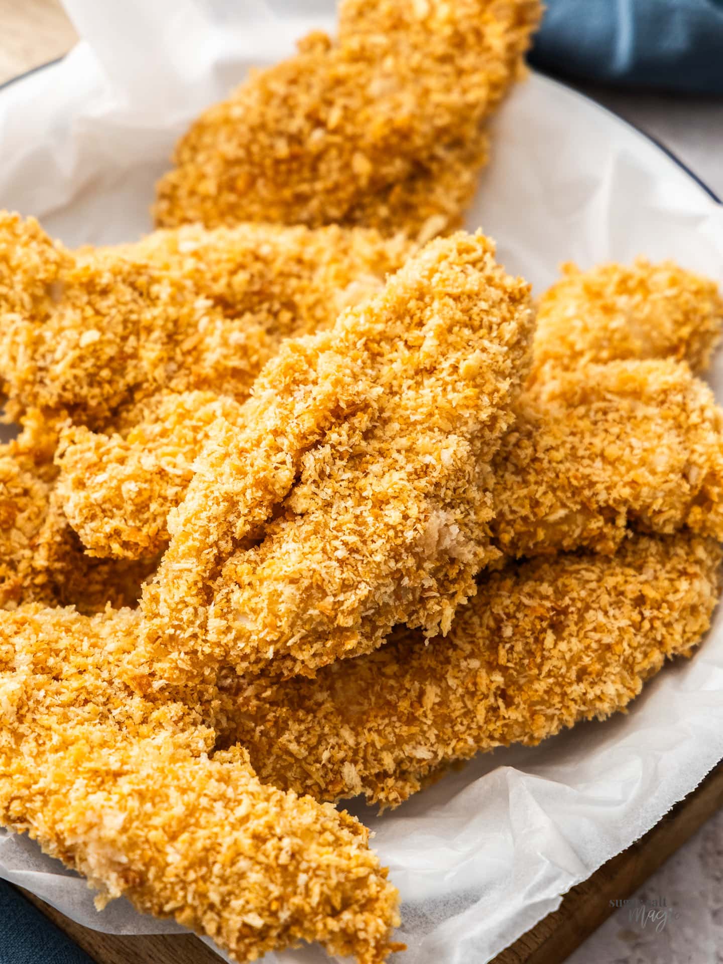 A batch of crunchy chicken tenders in a bowl.