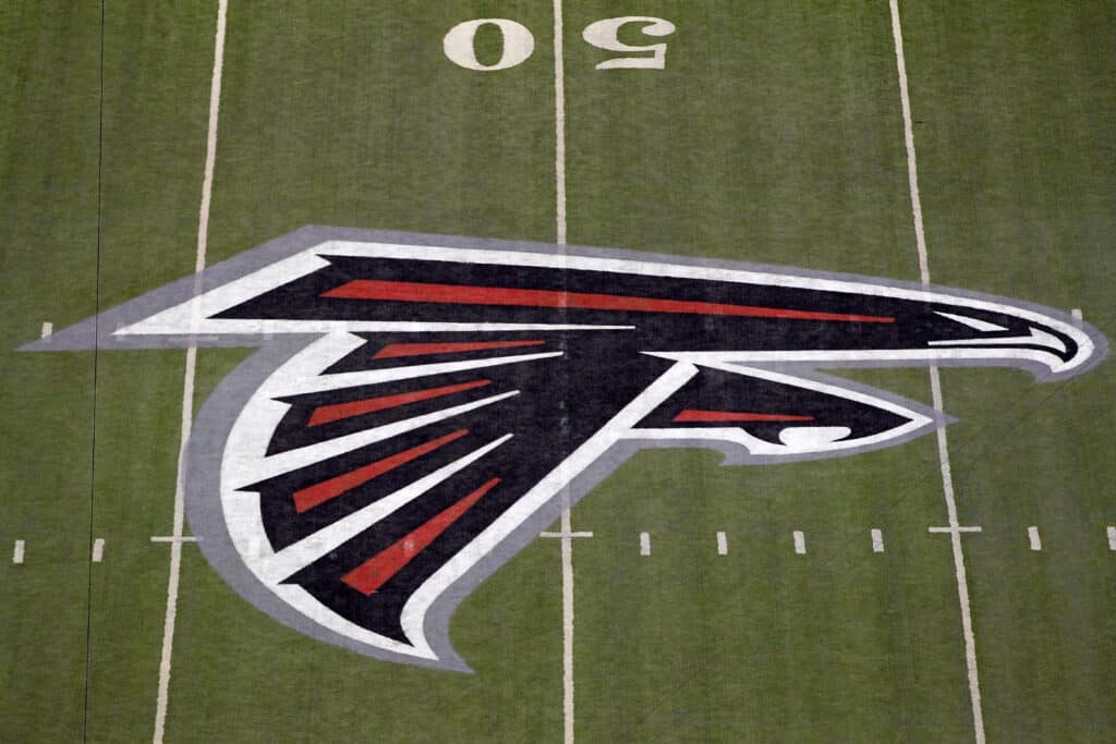 A detail of the Atlanta Falcons logo is seen at the 50 yard line against the Green Bay Packers during their 2011 NFC divisional playoff game at Georgia Dome on January 15, 2011 in Atlanta, Georgia.