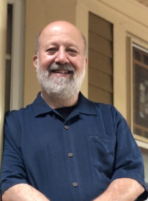 profile of person smiling at camera
