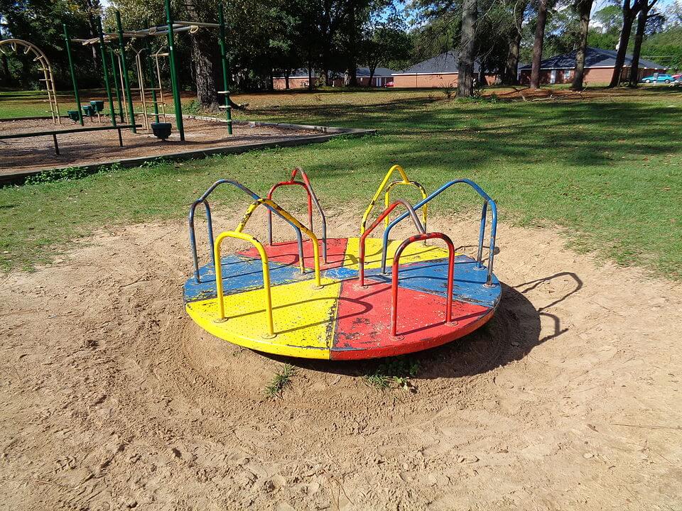 A carousel is a circular platform that you can spin around. If you are standing on the platform, you will feel the centrifugal force trying to toss you outward.