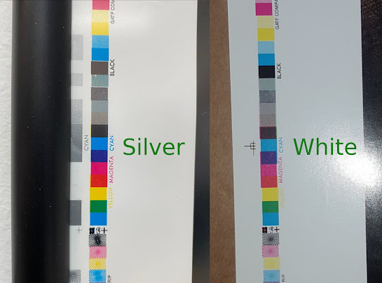 Two poster test print color bars, one has a single CMYK bar while the other has an extra silver strip for a total of two bars
