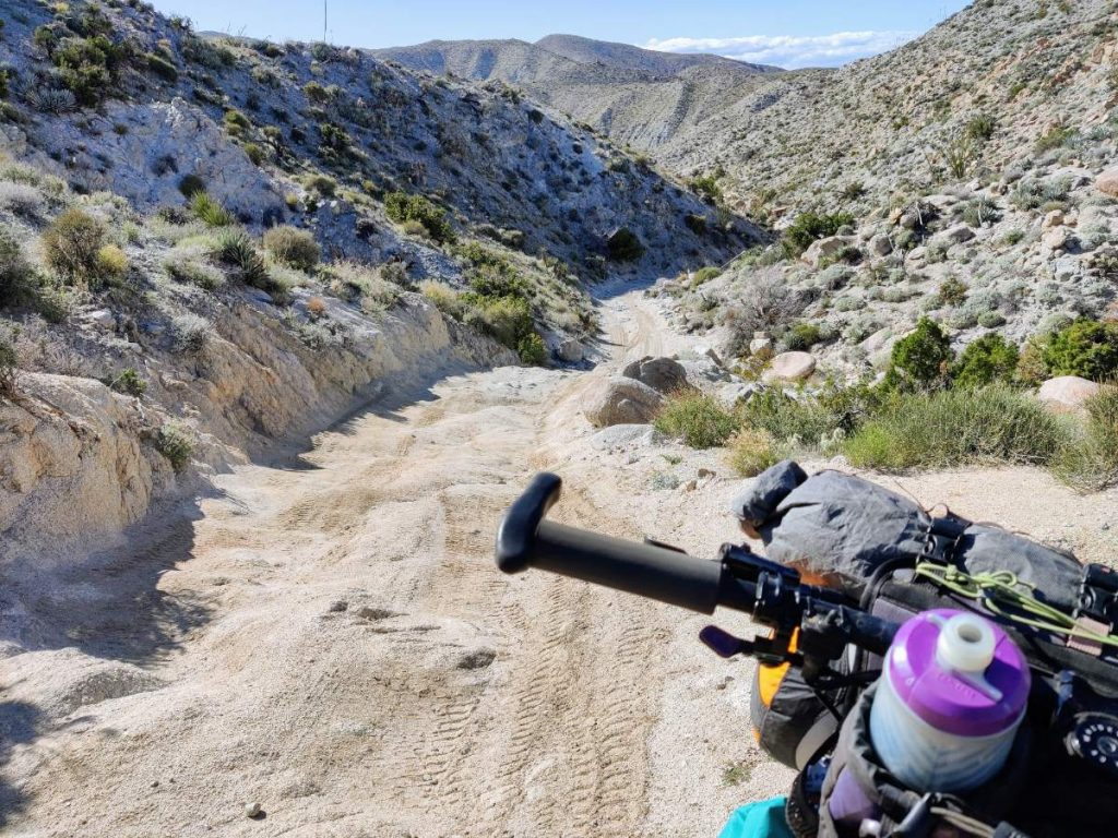 bikepacking bike on rough jeep road