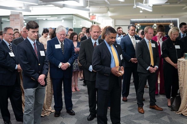 Guests reflect at the blessing and dedication of Notre Dame’s Washington Office.