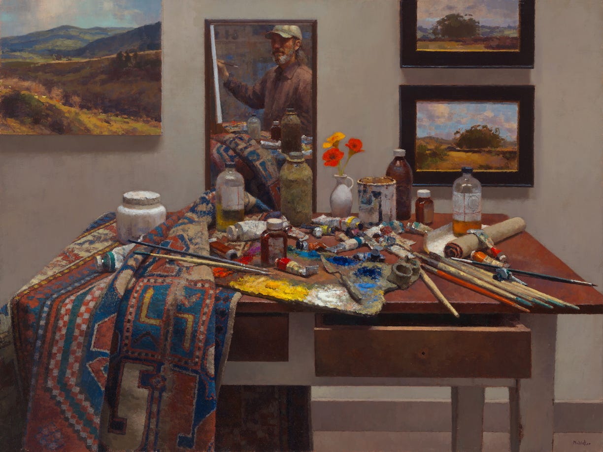 A painting table with art supplies and a painting of a person  Description automatically generated