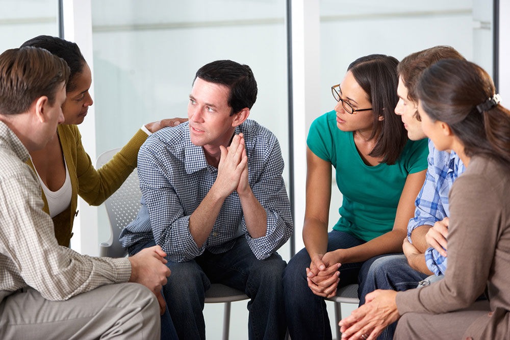 staging an intervention in a group setting to help someone with addiction
