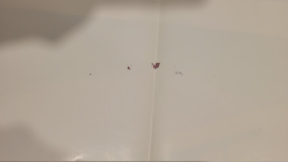Back has red ink transfer from another poster