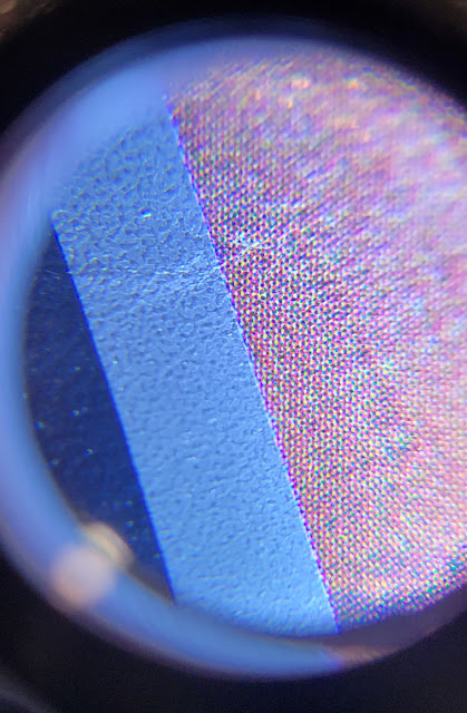 Magnified image of Jedi poster showing part of silver title surrounded by rosette patterns proving the silver was printed separately