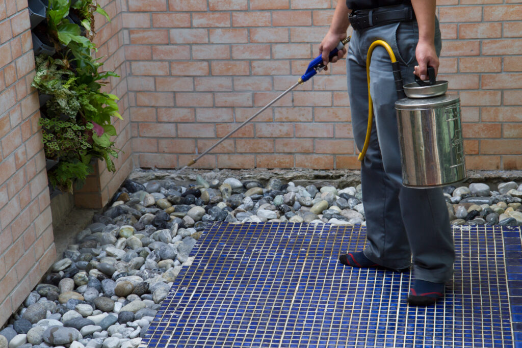 pest control officer working outside the house