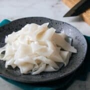 a plate of fresh rice noodles