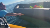 Police looking at video of anti-migrant activist Daniel Thomas slashing at boat with knife